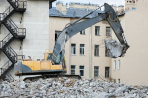 Building demolition with hydraulic excavator-destroyer